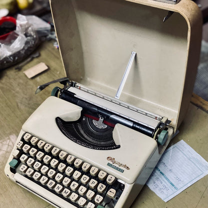 Olympia Splendid 33 portable typewriter with original case, vintage manual typing machine for writers and collectors