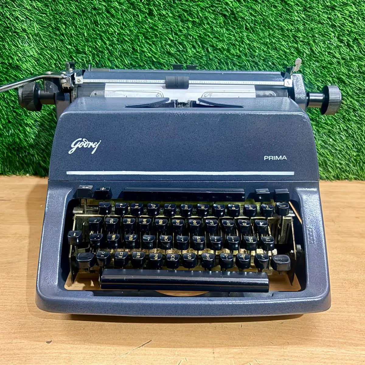 Godrej Prima Punjabi Typewriter with Gurmukhi keyboard, open front view showing keys, typebars and Foolscap carriage