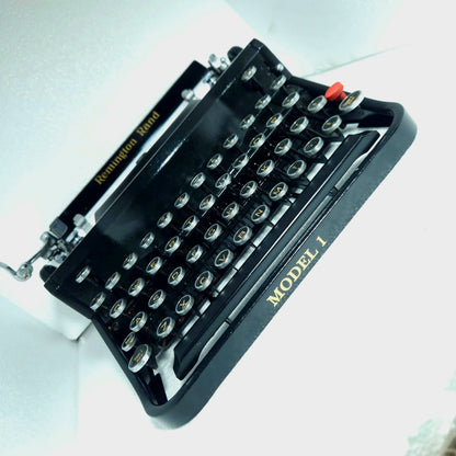 Remington Noiseless Model 1 manual typewriter front view with black finish, round keys and classic American design