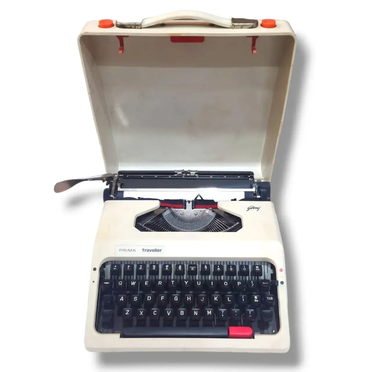 Godrej Prima Traveller portable typewriter with original carry case open, showing beige body and English keyboard