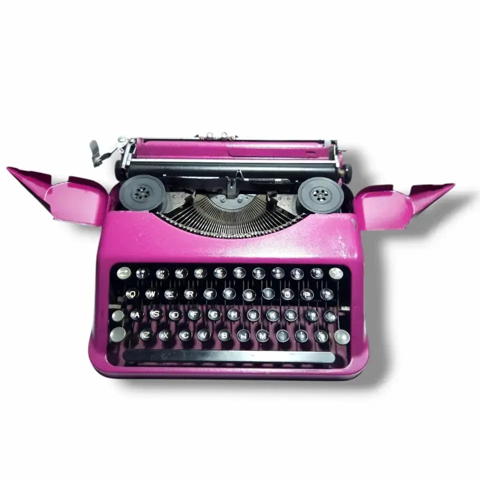 Open wing pink Hermes typing machine manual English typewriter at RR Typewriter Mart store