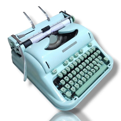 Angled mint green Hermes 3000 manual English typewriter by RR Typewriter Mart, Swiss classic