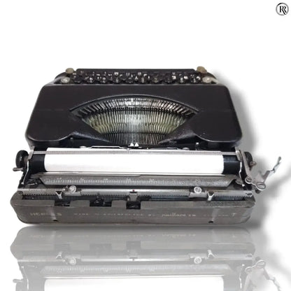 Rear view of Hermes Baby typewriter with carriage and typebars, imported manual typing machine from RR Typewriter Mart