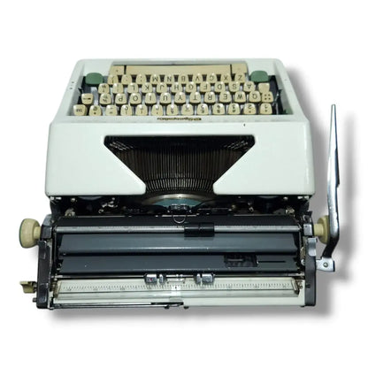 Rear view Olympia manual English typewriter with cream keys, imported typing machine for sale