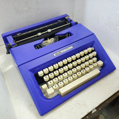 Top-left side angle of Olivetti Lettera 25 Typewriter showcasing ergonomic portable size | Rr Typewriter Mart
