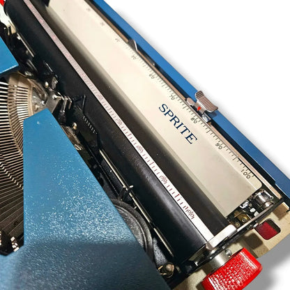 Royal Sprite portable manual typewriter carriage and platen close-up with original vintage branding