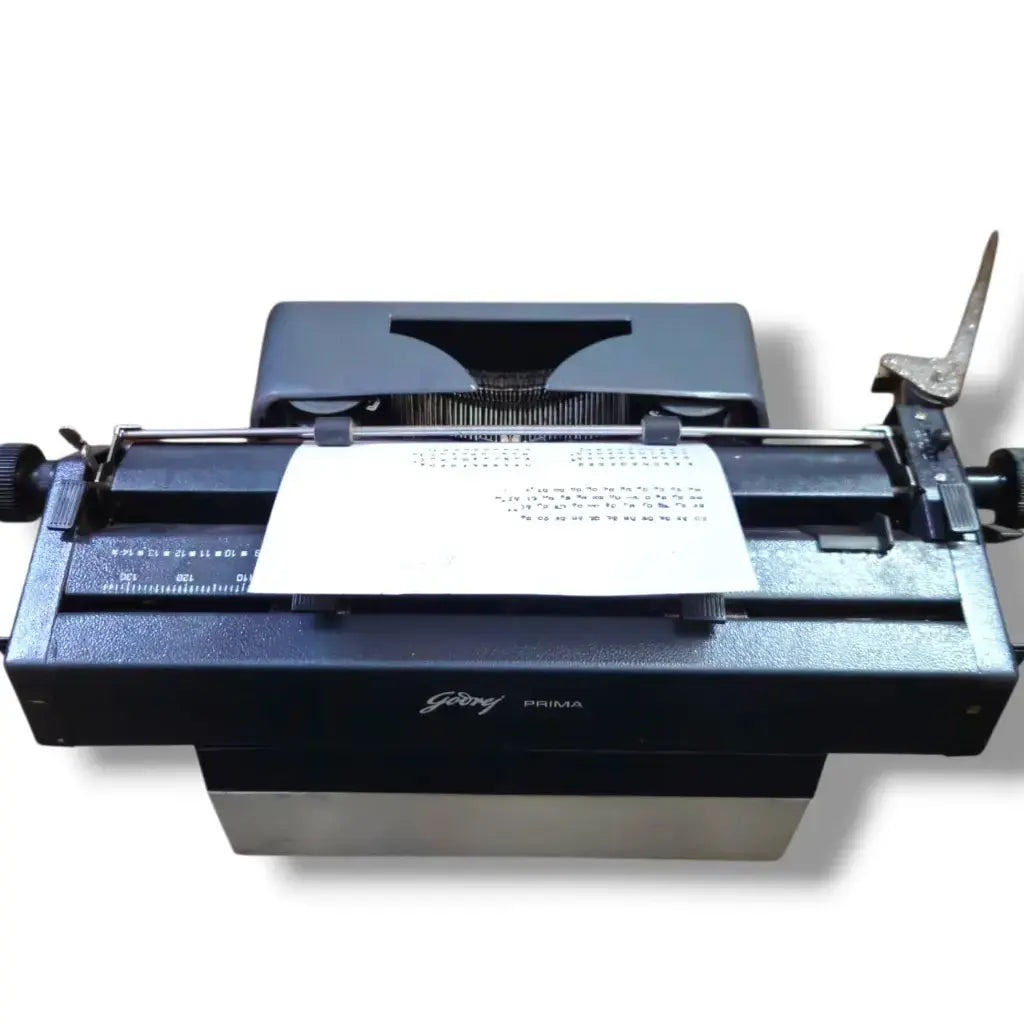 Rear view of Godrej Prima Kannada office typewriter with Kannada typing output
