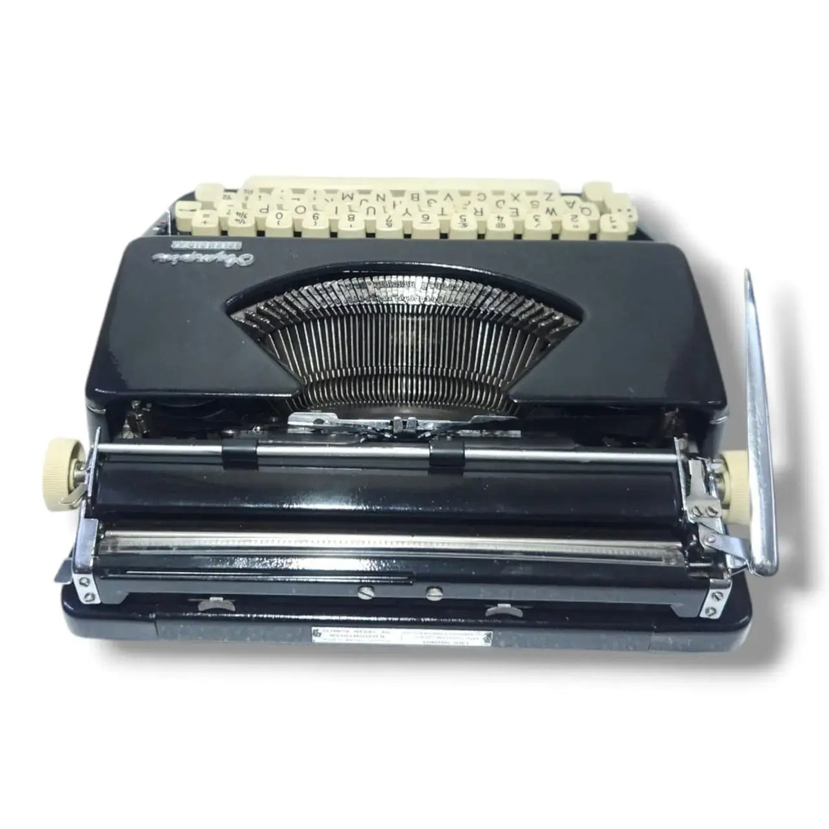 Rear view Olympia typing machine in royal black, manual English typewriter for writers & collectors
