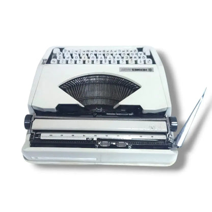 Rear view Hermes Baby typewriter with chrome carriage, manual English Typewriter for collectors and writers