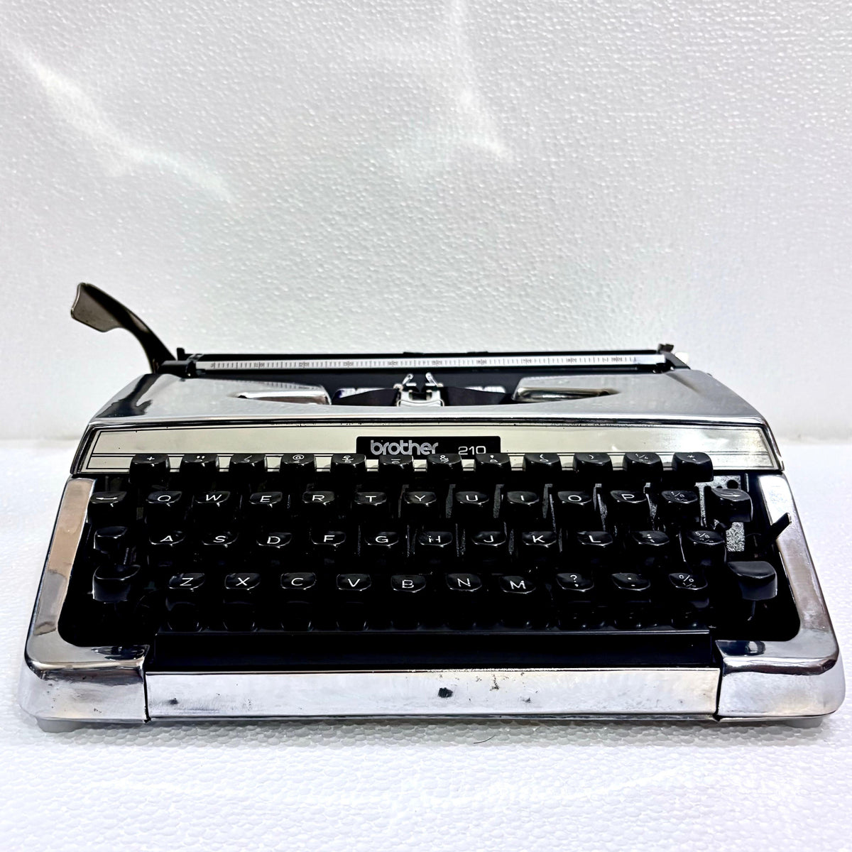 Brother 210 manual English typewriter in custom mirror chrome finish from RR Typewriter Mart India for writers