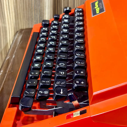 Brother Young Elite 513 typewriter identification label close-up, documenting model details on a vintage red portable machine | RR Typewriter Mart
