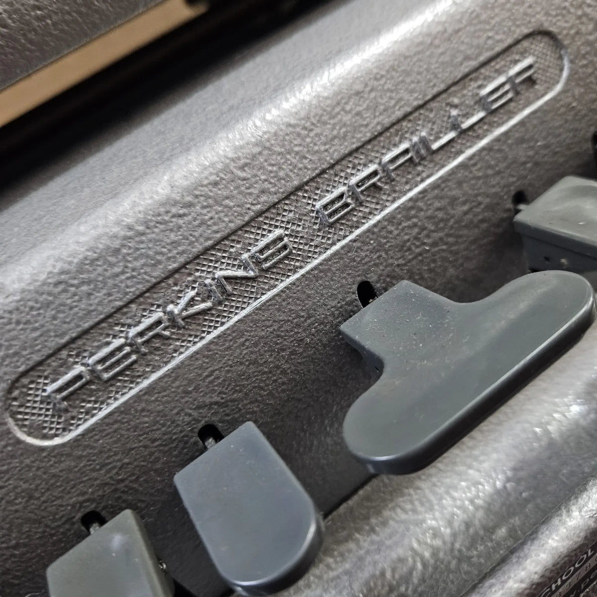 Close-up of Perkins Braille Typewriter keys and logo, imported braille typing machine sold by RR Typewriter Mart