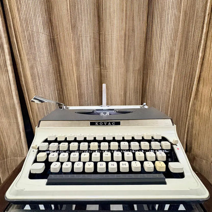 Buy Kovac M-101A portable typewriter featuring original factory grey and white colours and mint unused condition | RR Typewriter Mart