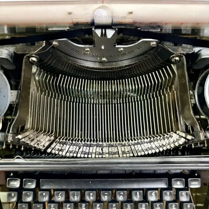 Internal typebars of a Manual Hindi Typewriter showing mechanics, serviced by RR Typewriter Mart Typewriter Seller