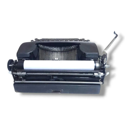 Smith Corona Clipper vintage typewriter rear view showing carriage, platen, typebars and solid mechanical construction