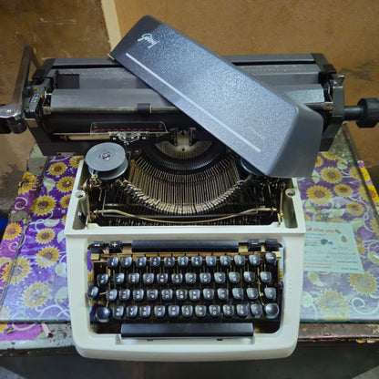Open body Godrej Prima Kannada typewriter showing internal typing mechanism
