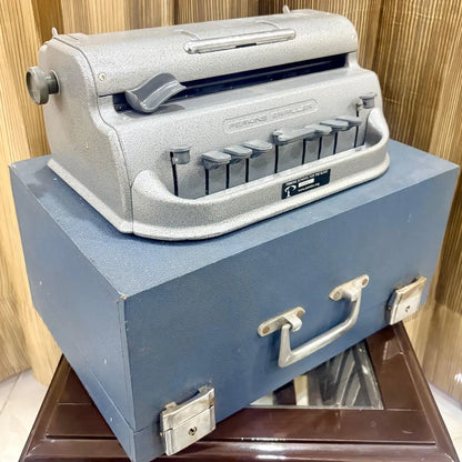 American assembled Perkins Brailler beside its rare blue wooden case, available from RR Typewriter Mart for Braille users in India.