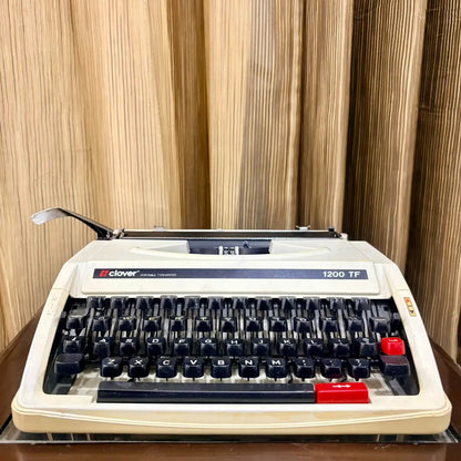 Clover 1200 TF portable manual typewriter with red TAB key, vintage typing machine from RR Typewriter Mart
