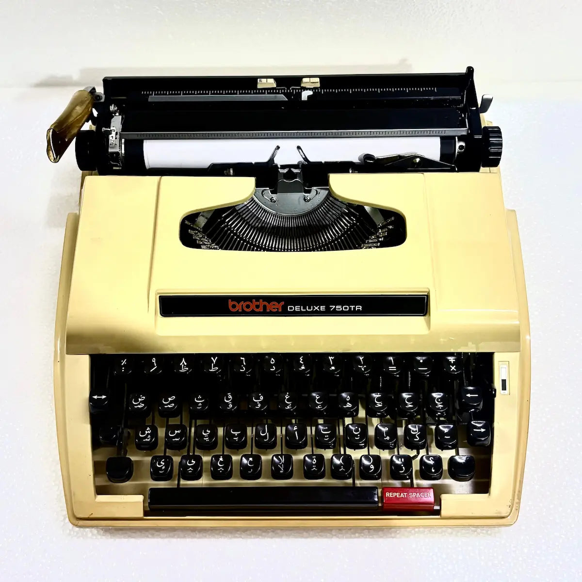 Brother Deluxe 750TR Arabic manual typewriter with Arabic layout, compact body and original hard case from RR Typewriter Mart in India