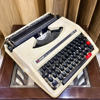 Clover 1200 TF manual typewriter close up, English keyboard and compact carriage, vintage typewriter seller