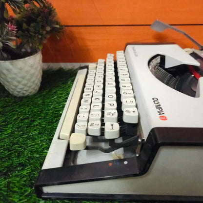 Brand New Olympia Traveller Deluxe Typewriter