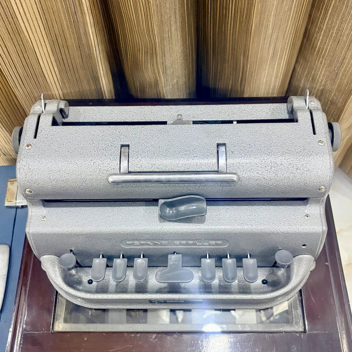 Three quarter front view of the American assembled Perkins Braille Typewriter showing its original factory finish at RR Typewriter Mart.