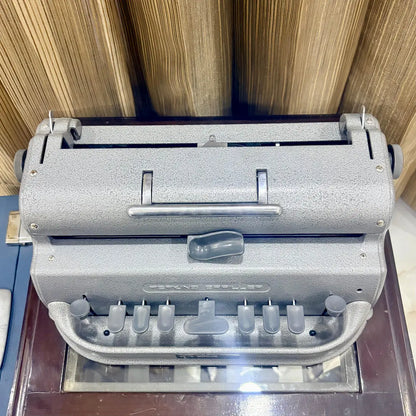 Three quarter front view of the American assembled Perkins Braille Typewriter showing its original factory finish at RR Typewriter Mart.
