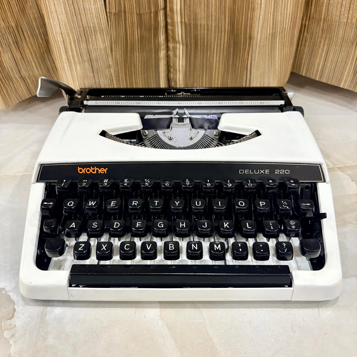 Brother Deluxe 220 Pearl White typewriter, portable mechanical typewriter with QWERTY keyboard by RR Typewriter Mart in India