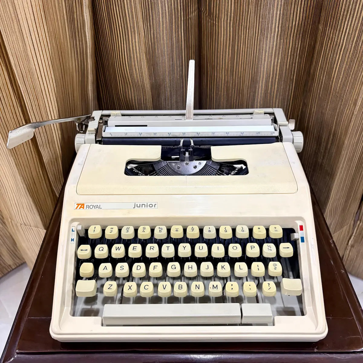Royal Junior semi portable typing machine with cream body, keyboard and hard case, from RR Typewriter Mart.