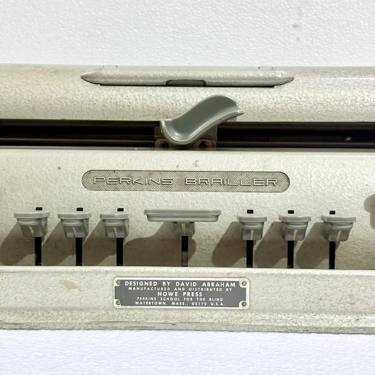 American Braille Typewriter featuring original gold-toned factory paint and sturdy metal construction, available from RR Typewriter Mart