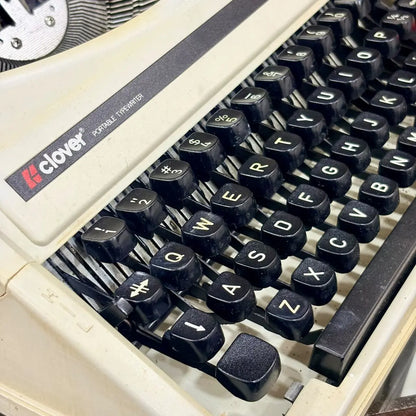 Clover 1200 TF ultra portable typing machine, cream vintage typewriter with black keys and red controls