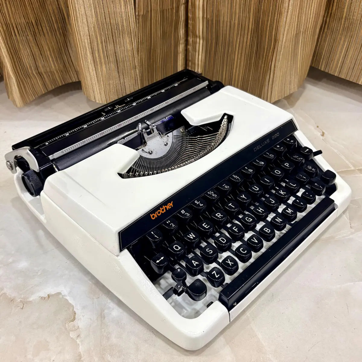 Brother Deluxe 220 Pearl White manual typewriter, portable mechanical QWERTY typewriter supplied by RR Typewriter Mart in India