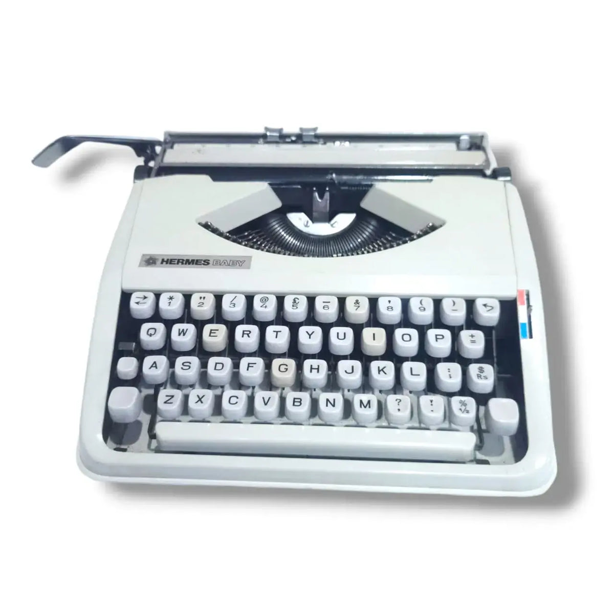 Front close view Hermes Baby typewriter, manual English Typewriter with crisp white retro body finish