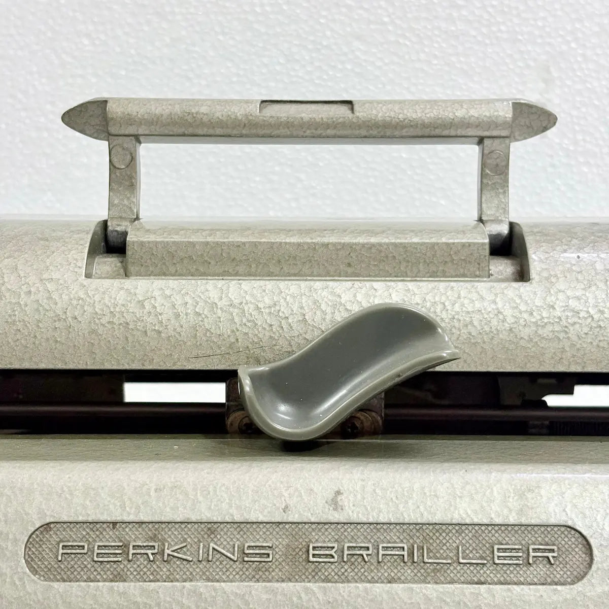 Braille Typewriter seller offering a mint-condition Perkins Brailler with original factory paint and professional servicing from RR Typewriter Mart
