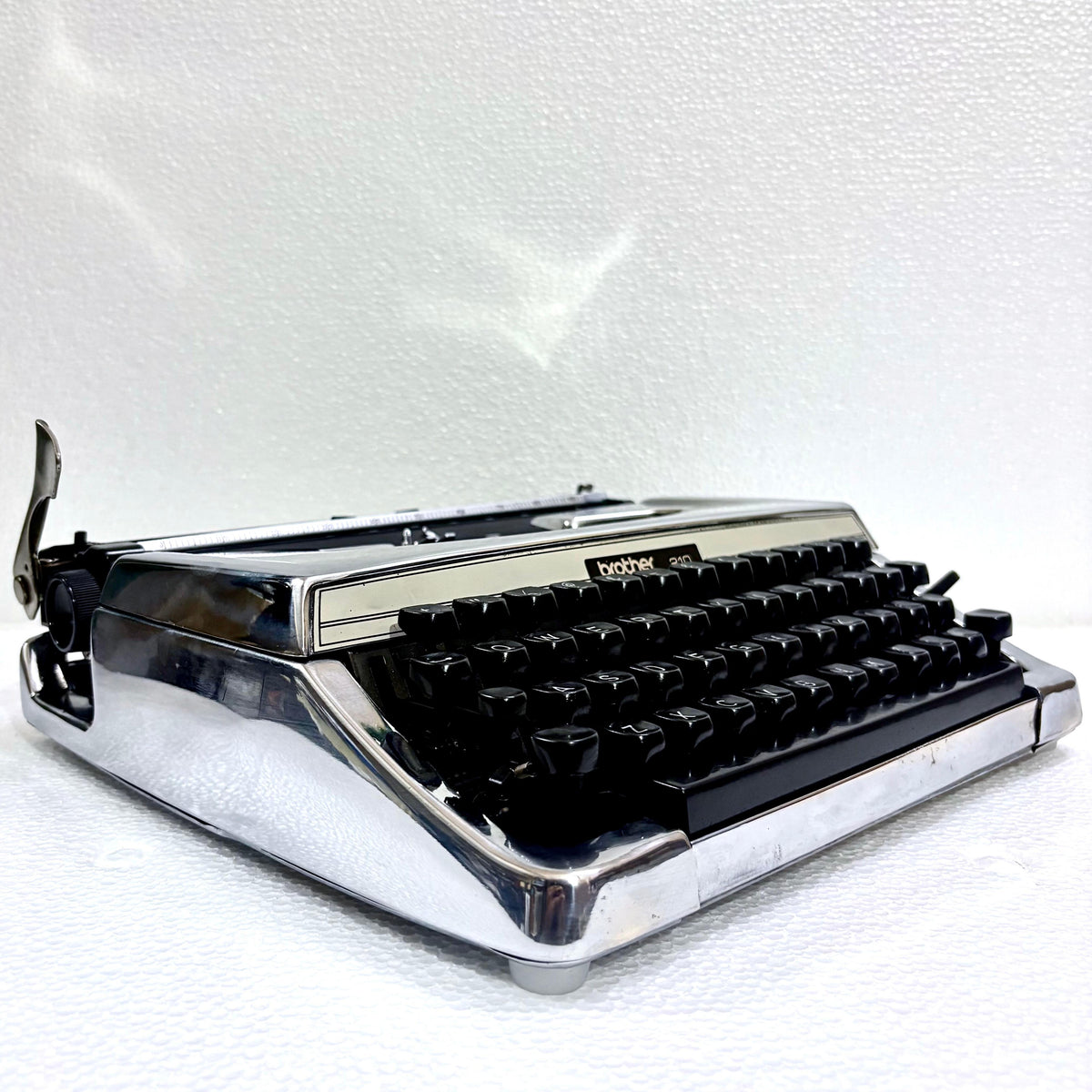 Vintage Brother 210 chrome manual typewriter with black keyboard from RR Typewriter Mart India for collectors