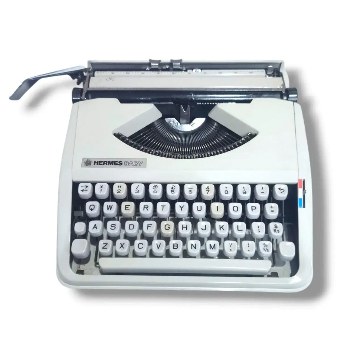 White Hermes Baby typewriter front view, Manual English Typewriter with premium Swiss styling details
