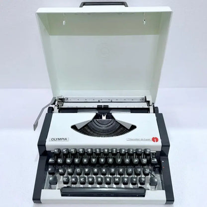 Olympia Traveller de Luxe portable typewriter fully restored German typing machine