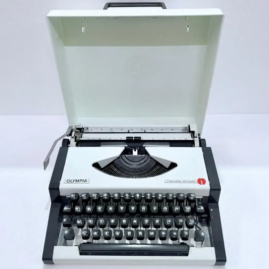 Olympia Traveller de Luxe portable typewriter fully restored German typing machine