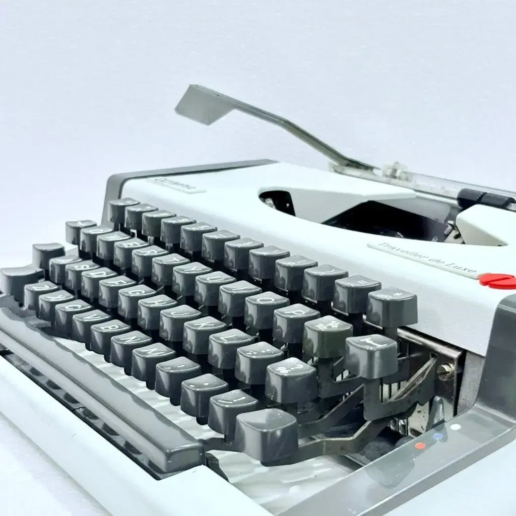 Professionally restored Olympia Traveller de Luxe classic portable typewriter