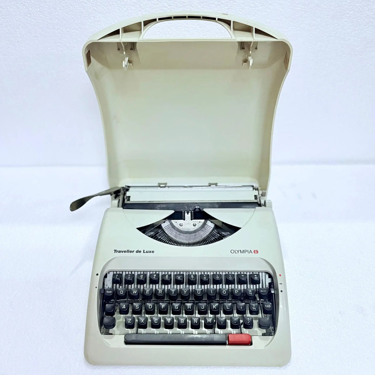 Front view of Olympia Traveller C manual typewriter, pearl white body, English keyboard, restored by RR Typewriter Mart!