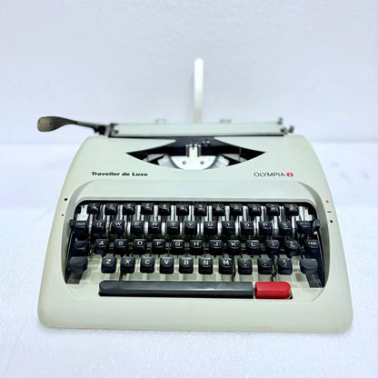 Side profile of Olympia typewriter with car inspired low design, pearl white manual typing machine by RR Typewriter Mart